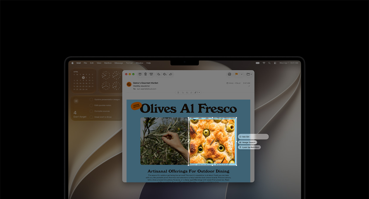 14palcový MacBook Pro, vesmírně černý, ukázka vizuální inteligence s e‑mailem, který obsahuje obrázky jídla a bylinek, obrázek oliv v chlebu ohraničuje rámeček a nad ním se zobrazují tři prompty: Ask Siri, Image Search a Look Up Nutrition