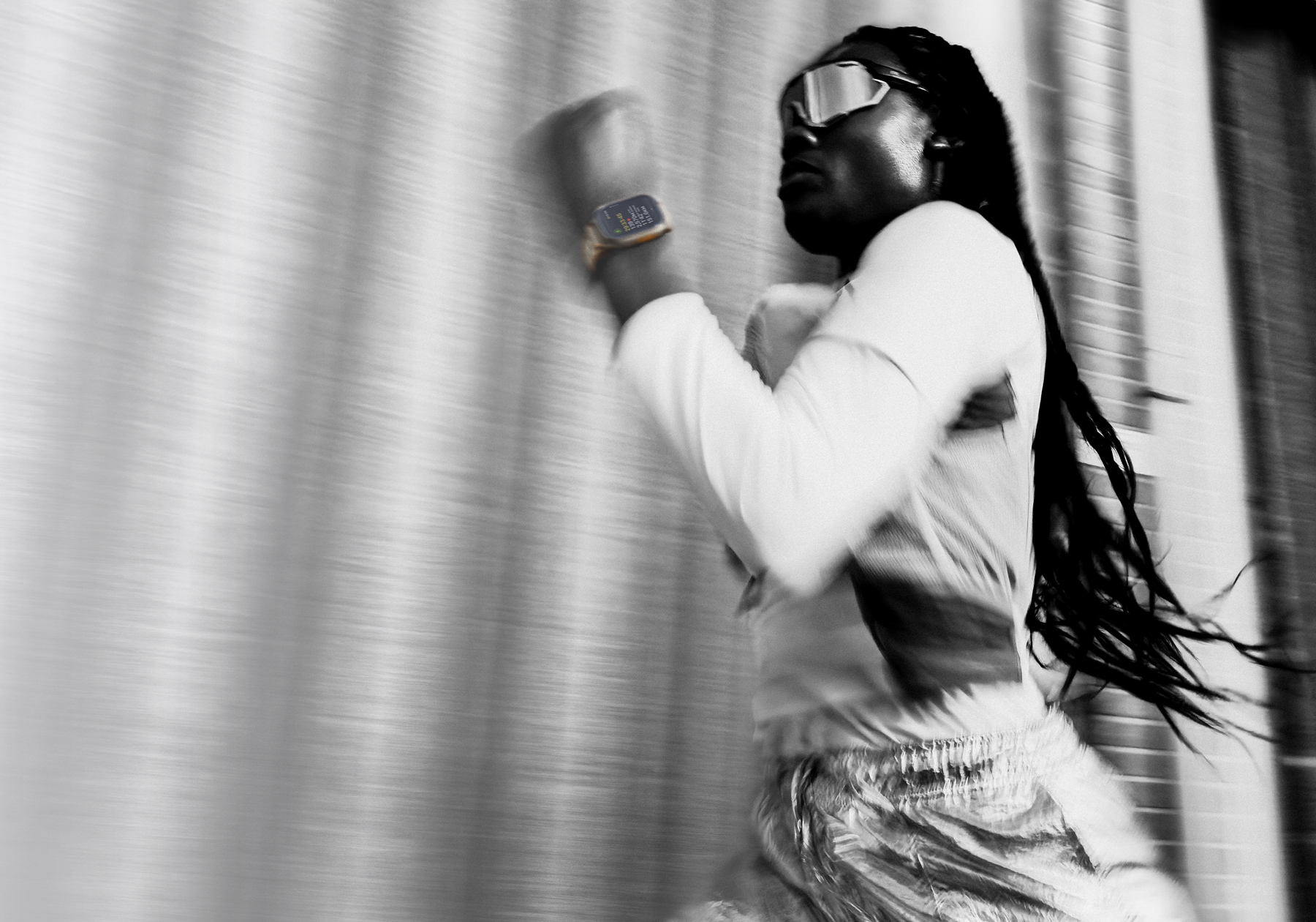 A person running while wearing Apple Watch Ultra 4