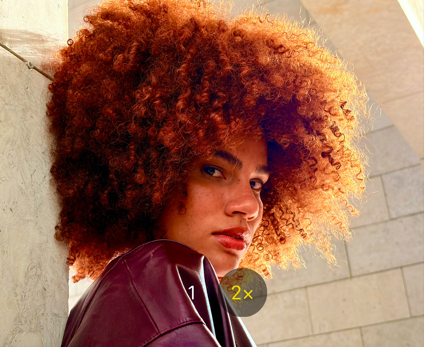 Photo of a person taken with 2x Telephoto camera feature